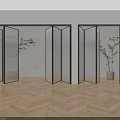 Modern Glass Folding Doors With Black Frames In Indoor Space Wooden Floor And Plant Decoration