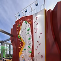 Colorful Holds On Red White Outdoor Climbing Wall Rooftop Structure With Railings