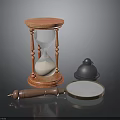 Vintage Desk Setup With Wooden Hourglass Brass Bell And Magnifying Glass
