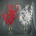 Red and White Decorative Flowers in Glass Vases on Gray Background