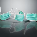 Three Green Disposable Face Masks Lying On Black Reflective Surface 3d model