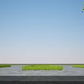 Modern Multi Storey Office Building With Gray Brick Exterior And Green Surroundings