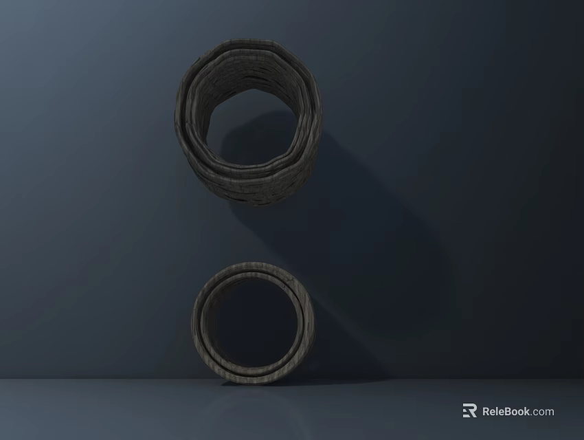 Two Decorative Woven Gray Circular Rings On Dark Indoor Background 3d model 