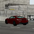 Red Sports Coupe Driving On Road With Industrial Concrete Building And Pipes