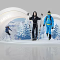 HHHT Ski Scene Display With Two People Holding Skis And Snowy Mountain Backdrop