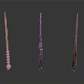 Three Unique Handcrafted Wands With Intricate Handle Designs And Wooden Textures