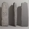 Three Stone Sculpture Carving With Intricate Celtic Knot Geometric Designs And Unfinished Block
