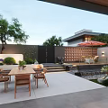 Stylish Courtyard Garden Landscape With Outdoor Dining Table Lush Plants And Trickling Water Feature