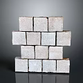 Stacked Gray Natural Stone Blocks With Textured Surface And Decorative Arrangement