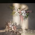 Elegant Floral Arrangement With Pink White Flowers Green Foliage And Scattered Petals