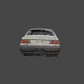 White Sedan Car With Missing Wheels And Worn Exterior Parts