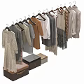 Neatly Arranged Various Styles Of Clothes Hanging On Hangers With Storage Boxes