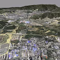 Satellite View of City Surrounded by Green Mountains and River With Residential Industrial Zones