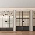 Modern Black Framed Glass Double Doors in Contemporary Interior With Wooden Flooring