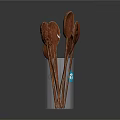 Wooden Utensil Set with Multiple Spoons Stored in Transparent Cup for Kitchen Use