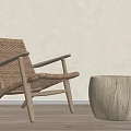 Natural Leisure Chair With Wicker Seat And Backrest And Wooden Frame Alongside Wooden Round Stool