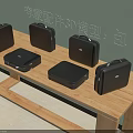 3D Models of Multiple Black Leather Cases on Wooden Table