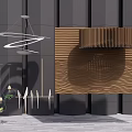 Modern Chandelier Hanging Over Gray Walls With Wooden Slatted Panels And Decorative Plants