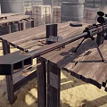 Sniper Rifle With Scope And Bipod On Wooden Table Near Ammunition Crates