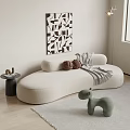 White Curved Sectional Sofa With Brown Pillows Gray Throw And Black White Geometric Wall Decor