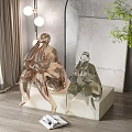 Seated Gold and Silver Toned Sculptures on White Platform in Modern Interior