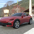 Red Sports Car Parked Outdoor With Mountain View Building And Flag