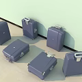 Blue Suitcases In Different Sizes With Wheels And Handles Against Light Green Wall