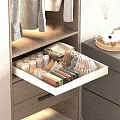 Wooden Wardrobe Drawer With Organized Folded Items And Colorful Storage Design
