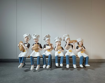 Modern Chef Sculpture Carving With Multiple Figures Holding Bread Sitting On Bench 3d model