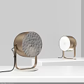 Modern Minimalist Golden Bronze Table Lamps With White Frosted Shades And Metal Stands On White Platform