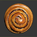 Freshly Baked Cinnamon Roll With Spiral Shape Golden Brown And Cinnamon Swirls On Black Surface