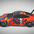 Porsche Race Car With Orange And Blue Camouflage Design And Rear Spoiler