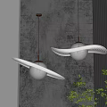 Two Modern Pendant Lights With Spherical Shade Gold Chain And Wavy Ring Decoration On Gray Wall