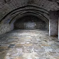 Elevator Passageway in Ancient Architectural Style With Stone Vaulted Ceiling Stone Walls and Stone Floor
