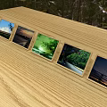 Multiple Photo Frames On Wooden Table Displaying Scenic Landscape