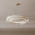 Modern Circular Chandelier With Layered White Shades And Soft Lighting Glow