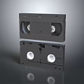 Black VHS Video Tapes Stacked On Gray Background With Retro Design Details