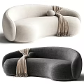 Light Beige and Dark Gray Curved Sectional Sofa with Round Pillow and Fringed Blanket
