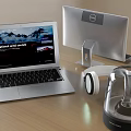 Modern Laptop And Dell Monitor Setup With Headphones On Wooden Desk
