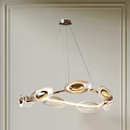 Elegant Modern Circular Metallic Pendant Light With Multiple Circular Lampshades Hanging From Ceiling