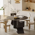 Modern Dining Room With Round Dining Table Chairs Pendant Light White Cabinets And Plant Decor