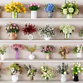 Various Types of Colorful Flowers In Decorative Vases On Multiple Shelves
