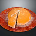 Orange Round Dessert On Red Wooden Plate With White Powder Topping And Sliced Piece