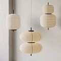 Japanese Style Layered Paper Lantern Chandeliers With White Shades And Black Frames Hanging On Wall