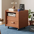 Wooden Storage Cabinet With Drawers On Wheels Topped With Radio Books Cup And Plant