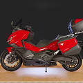 Red Modern Touring Motorcycle With Black Accents And Rear Storage Case