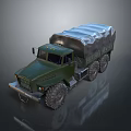 Green Military Tank With Tracked Wheels And Canvas Covered Cargo Area