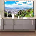 Modern Glossy Gray TV Stand With Large Screen TV Decorative Vases And Ornaments