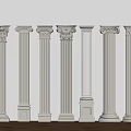 Various Styles of White Classical Columns Displayed Against Light Wall And Wooden Floor