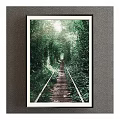 Scenic Landscape Painting Featuring Lush Green Vegetation Tunnel Railway Track And Sunlight Through Leaves